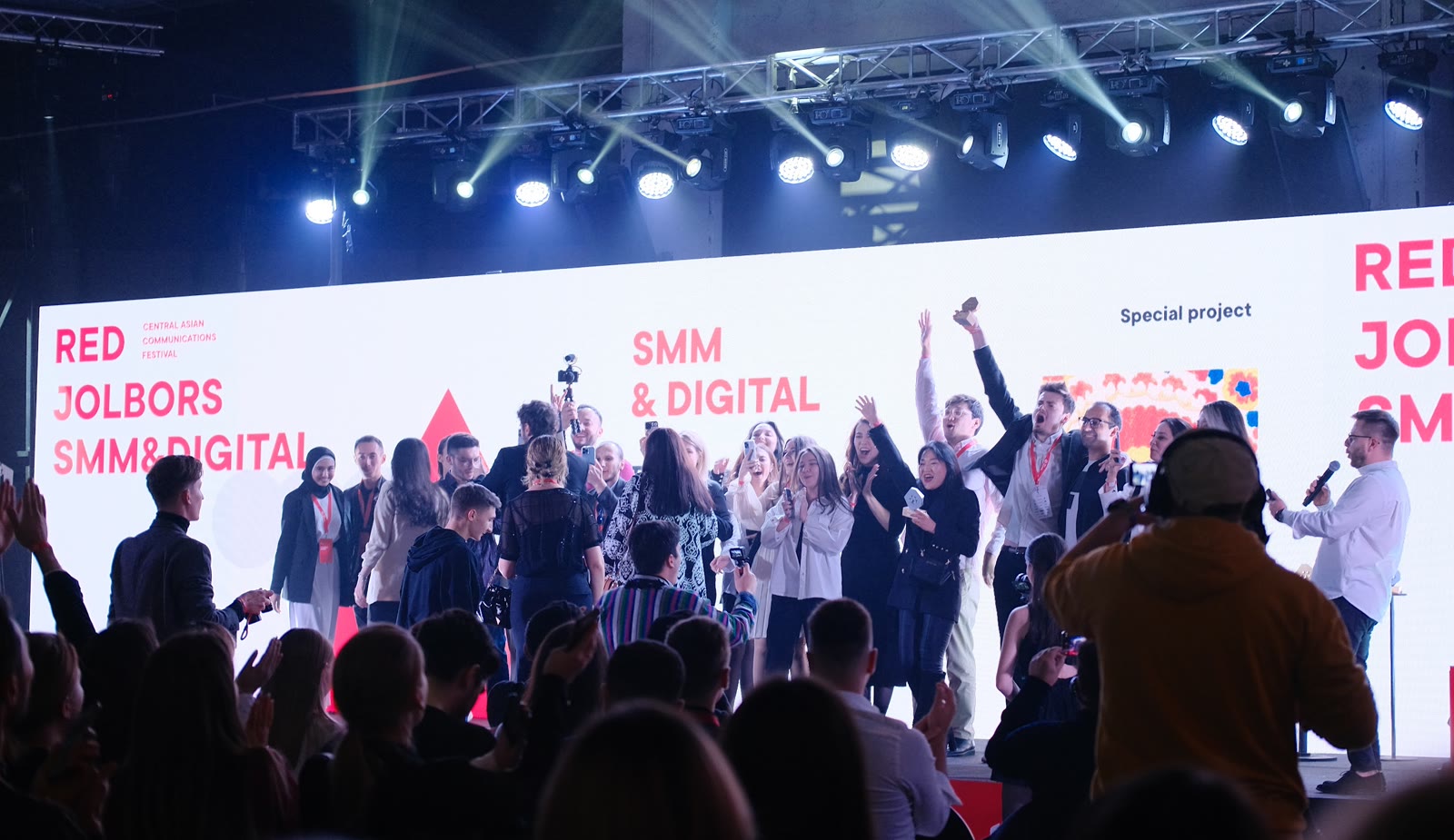 We Digital team on stage receiving an award at Red Jolbors Festival